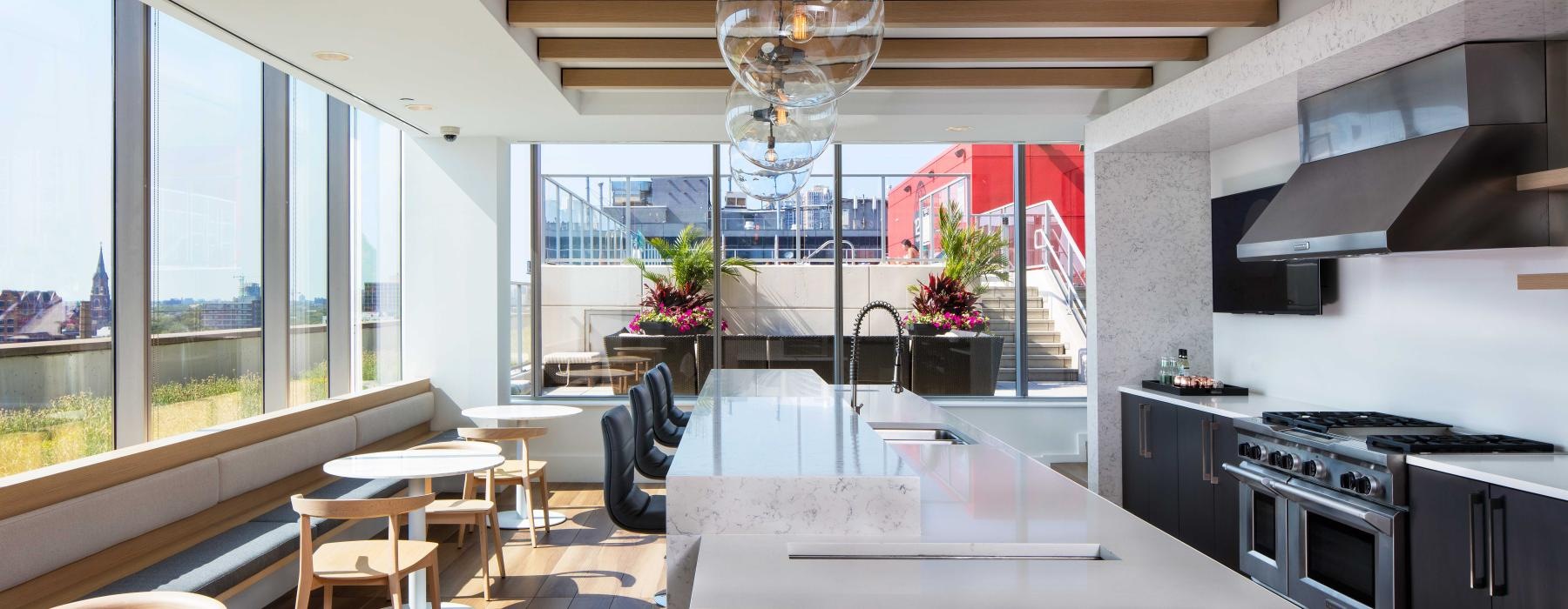 a kitchen with large windows