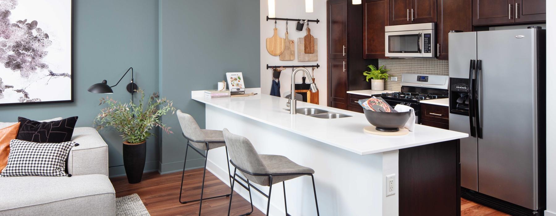 a kitchen with a white counter top