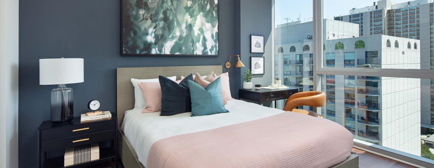 a bedroom with large windowa