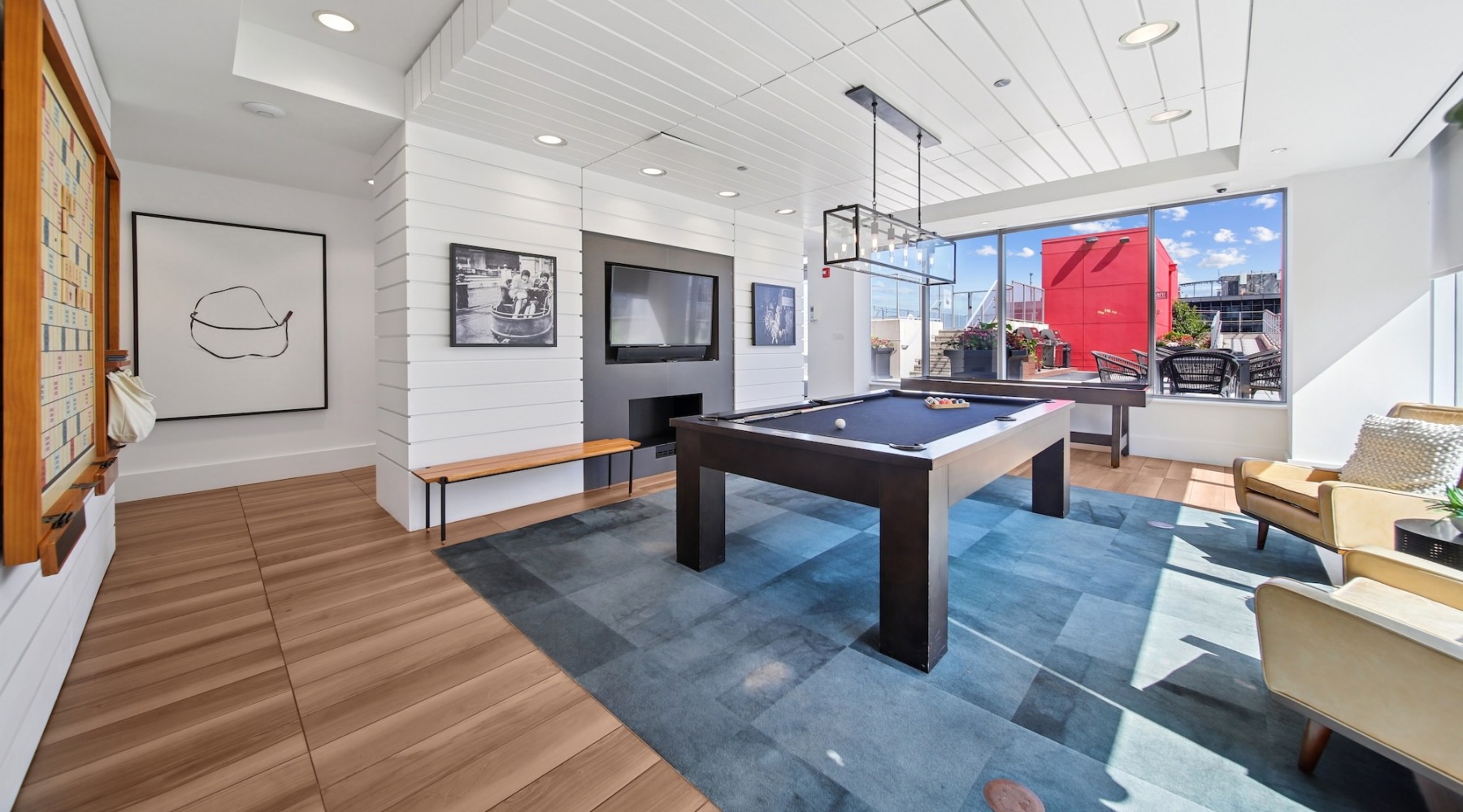 lounge with pool table and tv